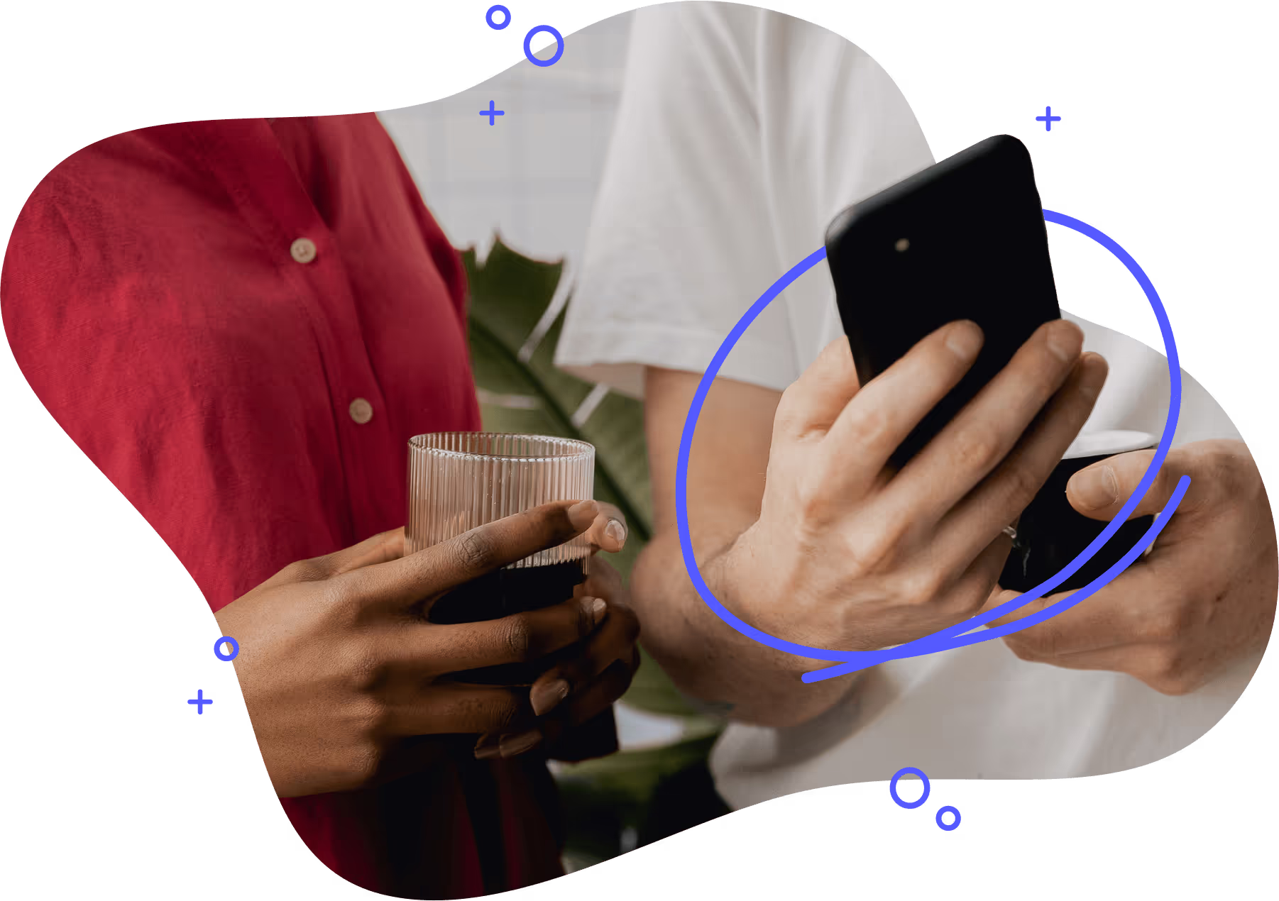 A man holding a cell phone shows a woman next to him what is on the screen